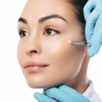 injecting a filler during the vampire facelift